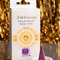Räucherkegel Ambrosia mit Kegel im Keramikhalter vor goldenem Hintergrund